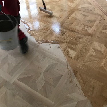 slipning av Stjärnparkett